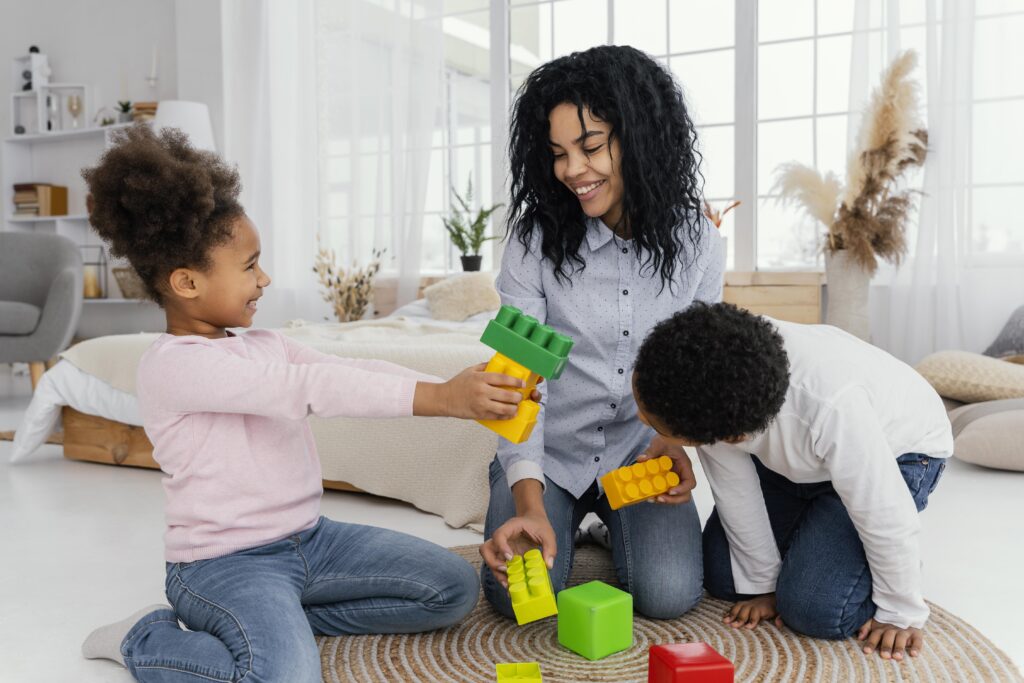 front view happy mother playing home with her children