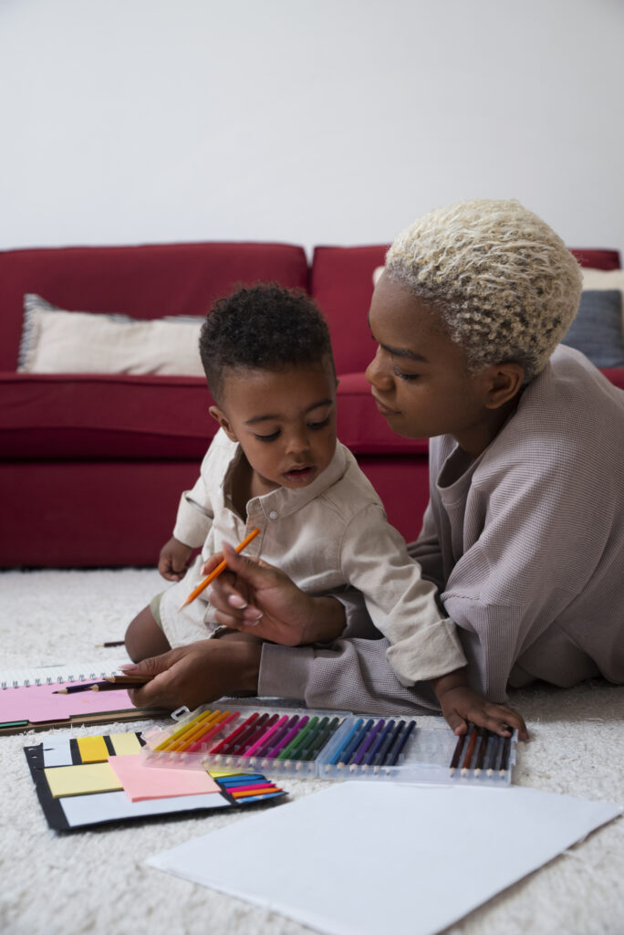 side view mother drawing with kid